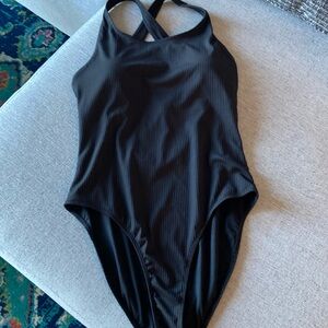 Extra large, one piece bathing suit press cross in the back